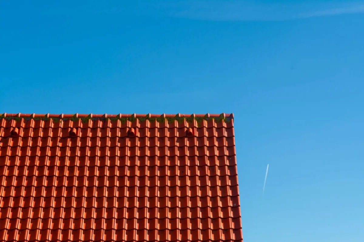 Tile roof gable in full sun, the kind of exposure that sets roof life in Manchester, NH
